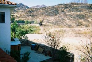 2003: this is a shot out of the back of Larry's back yard. It clearly shows how close the Californian Wildfires got to burning down his house.